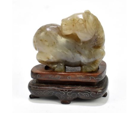 A Chinese carved and polished grey jade figure of a horse, length 4.5cm, now mounted on a modern wooden stand.Provenance: pri