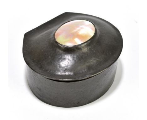 LIBERTY & CO; a pewter trinket box with shell inlay to the hinged lid and retaining original green silk stamped in gilt 'Libe