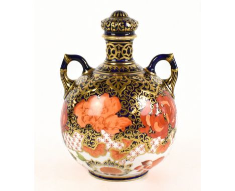 CROWN DERBY; a twin handled lidded vase of bulbous form, decorated with flowers on an Imari palette, height 17cm.Additional I