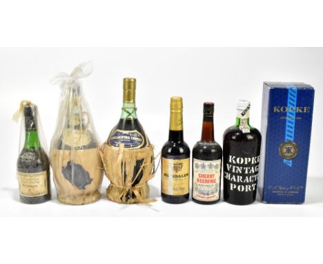 PORT; a single bottle of Kopke vintage character port, with a half bottle of Delamain cognac, a half bottle of Cherry Heering