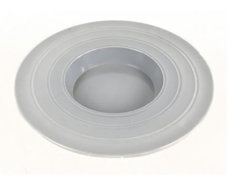 KEITH MURRAY FOR WEDGWOOD; a ceramic footed bowl of circular form with incised linear decoration on a grey ground, signed and