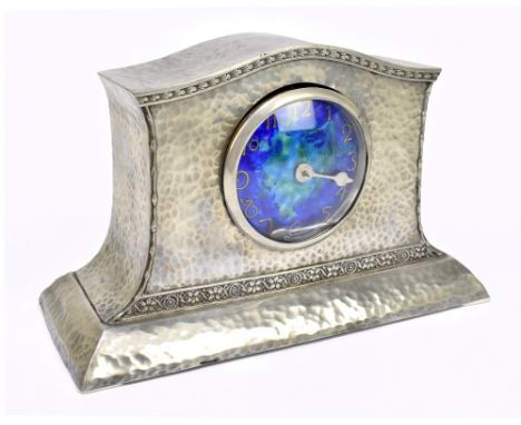 CASTLE PEWTER; an Arts & Crafts hammered pewter and enamel decorated mantel clock, with Arabic numerals to the blue/green dia