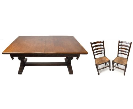 An 1920s oak extending dining table, on baluster supports, length 167cm, depth 98cm, height 75cm, together with a set of ten 