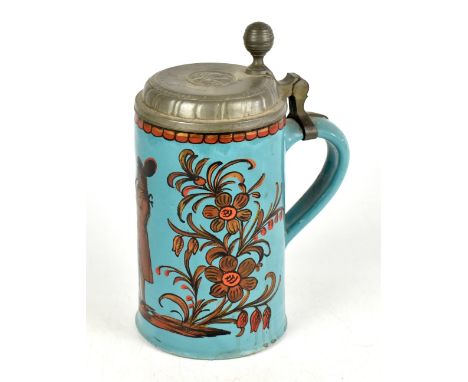 An 18th century German faïence stein, with hinged pewter lid engraved 'A.M.Körnerin 1796', the body decorated with figures an