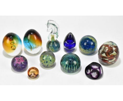 A collection of eleven glass paperweights, including two Mdina examples and a Caithness. (11).