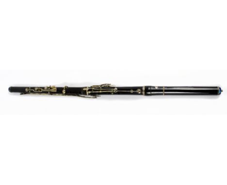 A 19th century Viennese ebony flute with white metal keys and mounts and enamel insets to either end, stamped I. Ziegler, Wie