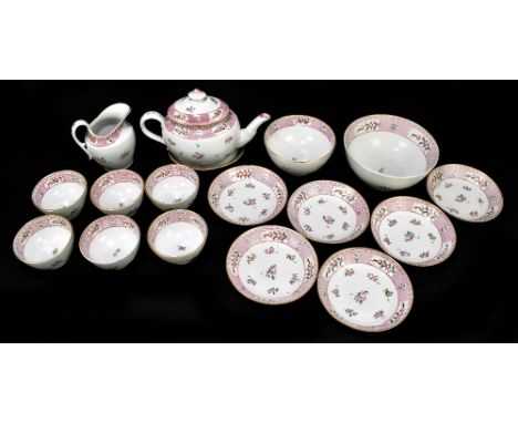 An early 19th century seventeen piece part tea service comprising teapot and stand, a slop bowl, a sugar bowl, a cream jug, s