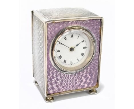 LIBERTY & CO; a leather cased George V hallmarked silver and pink guilloche enamel decorated travelling clock, the case with 