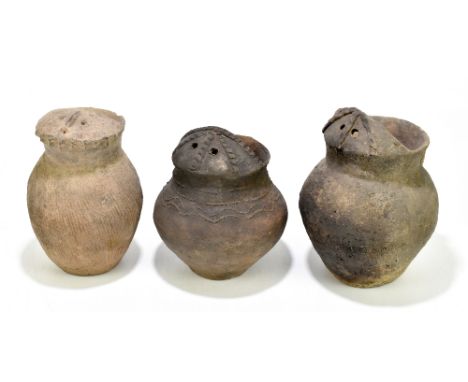 Three rare Chinese Neolithic period (circa 2nd Millennium BC) Qijai Culture jugs in the form of owls, height 22.5cm, 21cm and