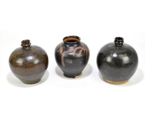 A Chinese Song Dynasty (960 - 1279 AD) brown glazed floral painted vase, height 21cm, a Song Dynasty black glazed jar, height