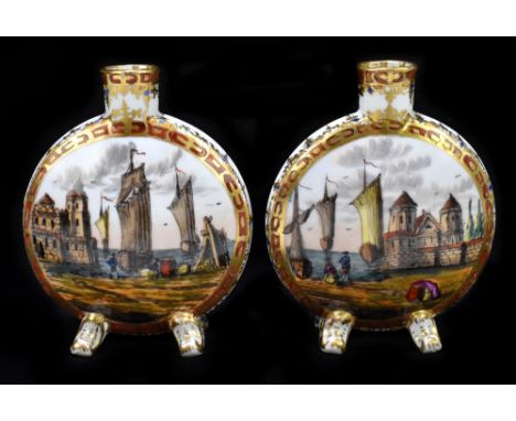 A pair of early 20th century Continental hand painted porcelain moon flasks, decorated with harbour and village scenes, with 