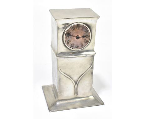 LIBERTY & CO; a Tudric pewter and copper mantel clock, no.0312, with Roman numerals to the circular copper dial within a shap