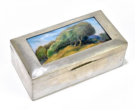 LIBERTY & CO; a pewter and enamelled casket, no.01021, the plaque decorated with trees in a landscape and with cedar lined ba