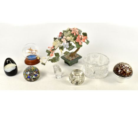 WATERFORD; a glass bottle coaster, with a Murano paperweight, a Caithness paperweight, three further paperweights, and a mode