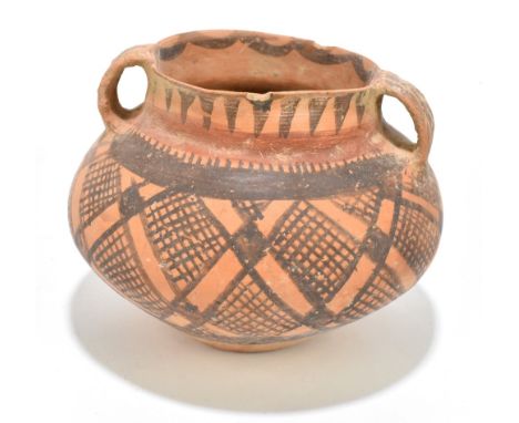 A Chinese neolithic twin handled jar with painted geometric decoration, height 14cm.Provenance: Private estate, Cheshire.