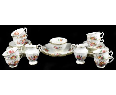 GEORGE JONES & SONS; a Crescent China thirty-four piece part tea service, decorated with floral motifs. 