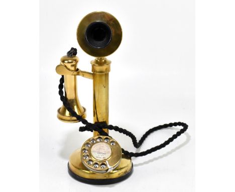 A vintage brass candlestick telephone, height 34cm (converted).