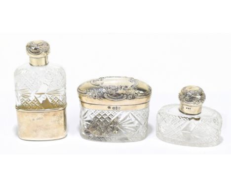 ALEXANDER CLARK MANUFACTURING COMPANY; a George V hallmarked silver mounted hip flask with cut glass body, the detachable cup