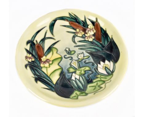 MOORCROFT; a plate decorated with water lilies and bulrushes, diameter 26cm.Additional InformationSome light glaze crazing, o