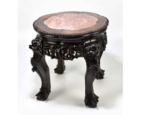 A Chinese carved hardwood marble top jardiniere stand, on claw and ball feet, height 38cm, diameter 34cm.Additional Informati