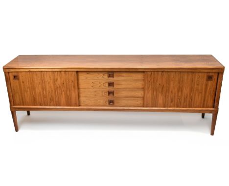 A Danish rosewood sideboard, with four central drawers, flanked by a pair of sliding doors, on turned column legs, width 225c