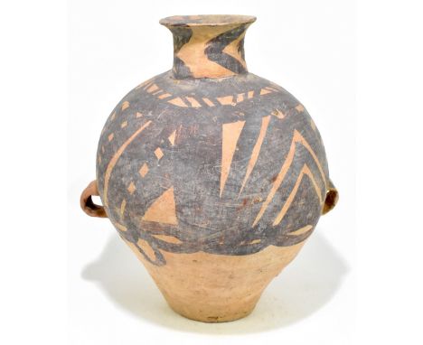 A Chinese Neolithic period (circa 2nd Millennium BC) Yangshao Culture buff red earthenware twin handled vessel with painted d