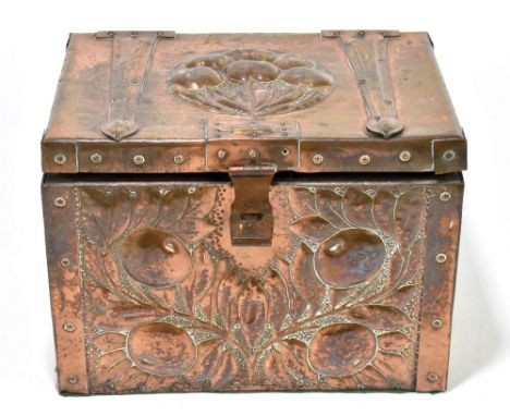 An Arts &amp; Crafts embossed copper clad casket with strap hinges, decorated with fruit and leaves, height 18cm, width 24.5c