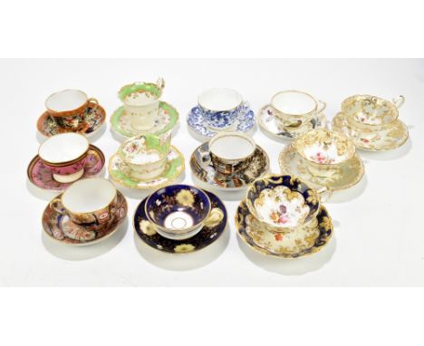 A collection of twelve 19th century and later English porcelain cups and saucers, to include three Imari examples, a pair pai