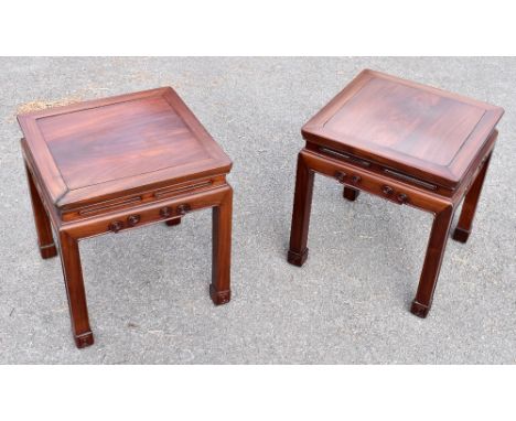 A pair of Chinese square sectioned occasional table with scroll detail, width 41cm, height 45cm.