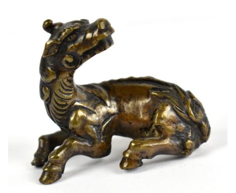 An 19th century Chinese scroll weight modelled as a kylin, length 5cm.Provenance: private collection UK. 