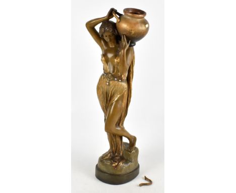 GOLDSCHEIDER; a figure of a female water carrier, signed F. Gross, the figure moulded with a belt embellished with five opal 