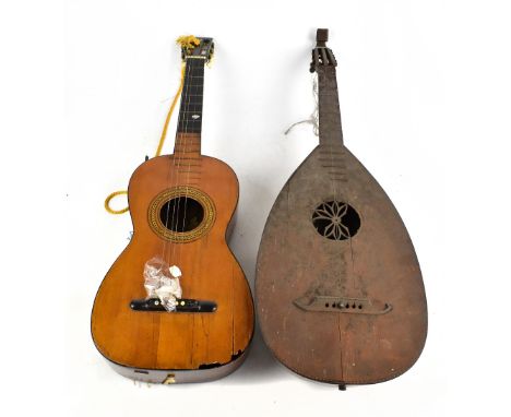 A Spanish acoustic guitar with interior label for Joseph Pages (af) and a lute (af) (2).Additional InformationBoth in need of