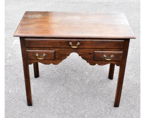 A George III style oak low boy, with three drawers, on chamfered legs, height 70cm, width 86cm, depth 44cm.&nbsp;Additional I