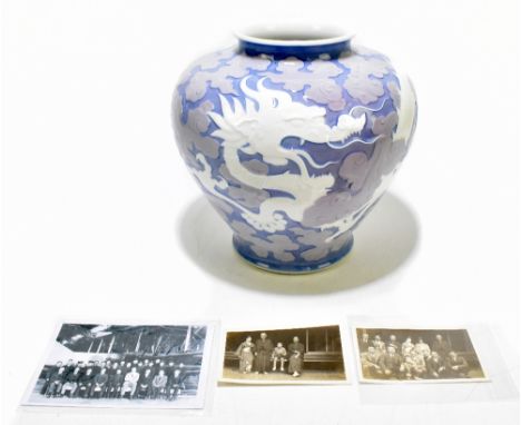 An early 20th century Japanese Fukugawa porcelain vase decorated with a three claw dragon amongst clouds, on lilac ground, st