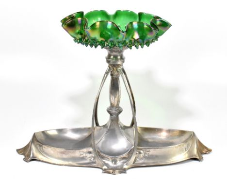 An Art Nouveau polished pewter centrepiece in the manner of WMF, with iridescent moulded glass bowl with wavy rim, supported 