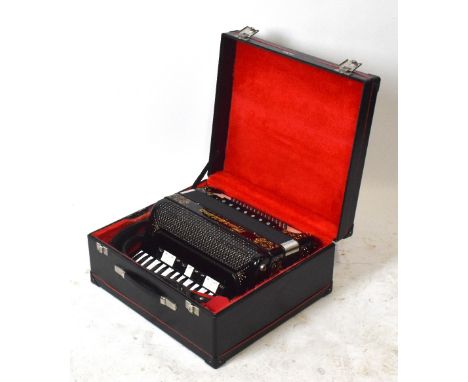 BRANDONI MUSETTINA; a piano accordion, with gilt detailing and black finish, serial number 131, in black case, with various c