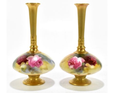 ROYAL WORCESTER; a pair of hand painted vases of squat form with flared cylindrical necks, painted with roses, shape number 1