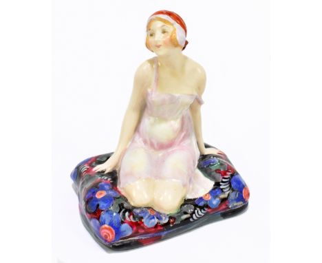 LESLIE HARRADINE FOR ROYAL DOULTON; a figure, HN1219 'Negligee', introduced 1927, withdrawn by 1938, decorated on a floral cu