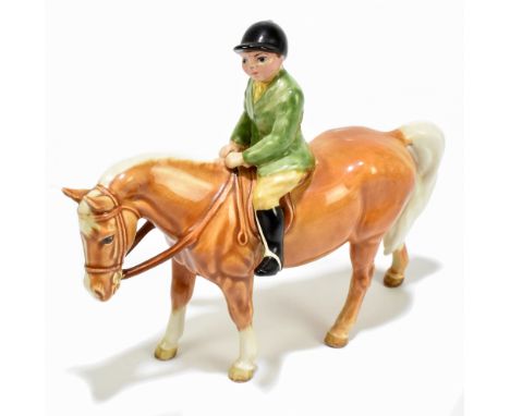 BESWICK; a figure of a boy in a green jacket on a Palomino pony, number 1500.Additional InformationThe Riders right foot has 