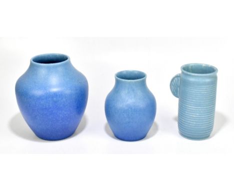 ROYAL LANCASTRIAN; three Art Pottery vases including a cylindrical example with ribbed body and side handle, height 18.5cm, a