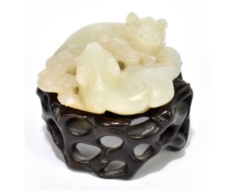 A Chinese carved jade sculpture of two rats, on carved hardwood base, width 4cm.
