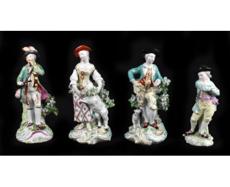 DERBY; a pair of 18th century dry edge figures of a shepherdess and a huntsman, tallest 20cm, with a Derby figure of a musici