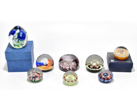 A collection of glass paperweights including Strathearn and Caithness examples, including a limited edition example decorated