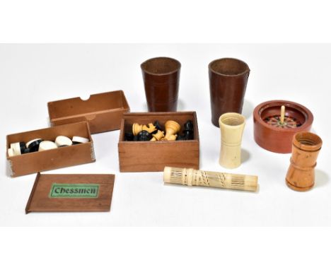 An assortment of vintage games including a John Jaques &amp; Sons chess set, a bone dice thrower, a bone gaming counter holde