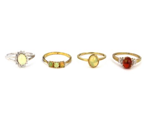 Four 925 silver opal set rings.