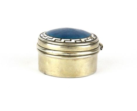 An enamelled hallmarked silver patch box, Dia. 3cm. Condition : some damage to enamel.