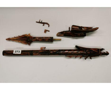 An Indonesian carved bone dragon and bird blow pipe, full L. 77cm.