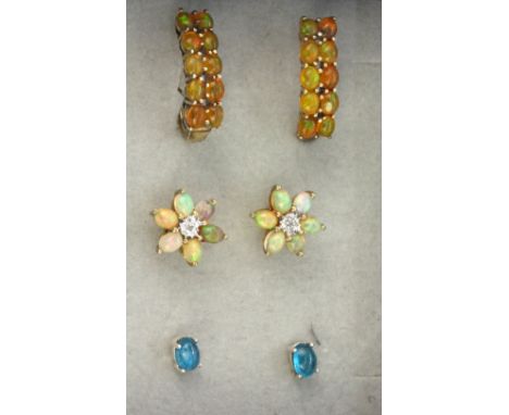 Two pairs of 925 silver opal set earrings and a further pair of stud earrings.