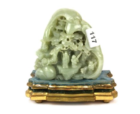 A fine 19th/ early 20th Century Chinese signed carved jade mountain scene, on a French gilt wood stand with an impression of 