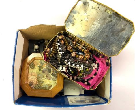 A box of costume jewellery, with a jewellery stand of costume jewellery.